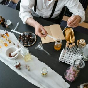 A detailed setup of an artisanal perfume-making process in a laboratory environment.